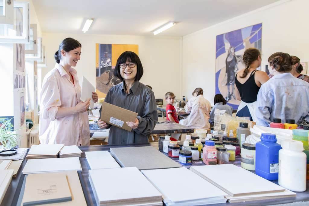 Young people at work in a museum studio.